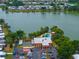 Aerial view of the community clubhouse, parking, and a lake at 2055 S Floral Ave # 269, Bartow, FL 33830