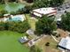 Aerial view of community clubhouse with a pool, lake access, and parking at 2055 S Floral Ave # 269, Bartow, FL 33830