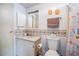 Standard bathroom featuring white fixtures and seashell-themed decor at 2055 S Floral Ave # 269, Bartow, FL 33830