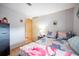 Inviting bedroom with a flamingo-themed blanket and comfortable setup at 2055 S Floral Ave # 269, Bartow, FL 33830