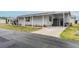 Charming home featuring a side driveway, storage shed, and well-maintained landscaping at 2055 S Floral Ave # 269, Bartow, FL 33830