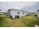 Exterior view of home with a carport and grassy yard at 2055 S Floral Ave # 269, Bartow, FL 33830