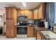 Kitchen with stainless steel appliances and oak cabinets at 2055 S Floral Ave # 269, Bartow, FL 33830