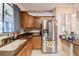 Spacious kitchen boasts stainless steel appliances, wood cabinets, and a kitchen window at 2055 S Floral Ave # 269, Bartow, FL 33830
