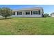 Well maintained backyard showing a meticulously manicured green lawn at 2085 Long Boat Dr, Lakeland, FL 33810