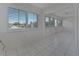 Airy dining space featuring tile flooring, white walls, lots of natural light, and an open connection to other living spaces at 2085 Long Boat Dr, Lakeland, FL 33810