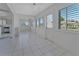 Bright dining area with tiled floors, white walls, lots of natural light, and seamless transition into the kitchen at 2085 Long Boat Dr, Lakeland, FL 33810