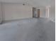 Open-concept living area with neutral carpeting, light walls, and multiple entryways for optimal flow at 2085 Long Boat Dr, Lakeland, FL 33810