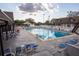 Inviting community pool surrounded by lounge chairs and a well maintained deck area at 2085 Long Boat Dr, Lakeland, FL 33810