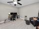 Bedroom featuring light wood floors, a seating area, ceiling fan and a desk with computer at 219 Ariana St # A-B, Lakeland, FL 33803