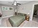 Inviting bedroom featuring a comfortable bed, natural light, and minimalist decor at 219 Ariana St # A-B, Lakeland, FL 33803