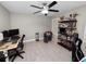 Bedroom area features a ceiling fan, shelving unit, a desk with computer and a comfortable seating area at 219 Ariana St # A-B, Lakeland, FL 33803