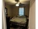 Comfortable bedroom featuring a bed, fan, and natural light at 219 Ariana St # A-B, Lakeland, FL 33803