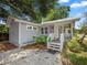 Charming gray home featuring a spacious front yard and inviting covered porch at 219 Ariana St # A-B, Lakeland, FL 33803