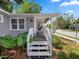 Inviting front porch view featuring neutral siding, bright white trim, and space to relax at 219 Ariana St # A-B, Lakeland, FL 33803