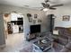 Cozy living room featuring modern decor, light wood floors, and an arched entry to the adjacent kitchen at 219 Ariana St # A-B, Lakeland, FL 33803