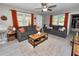Inviting living room with neutral walls, wood-style flooring, sofas, and natural light from windows at 219 Ariana St # A-B, Lakeland, FL 33803