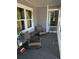 Relaxing front porch area with outdoor seating and views of the surrounding greenery at 219 Ariana St # A-B, Lakeland, FL 33803