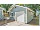 Detached single-car garage boasts a white door and ample space for parking and storage at 2203 Avenue F Nw, Winter Haven, FL 33880