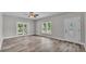 Bright living room with wood-look vinyl floors, ample natural light, and a welcoming entryway at 2203 Avenue F Nw, Winter Haven, FL 33880
