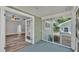 Inviting enclosed porch with access to the living room and views of the spacious backyard at 2203 Avenue F Nw, Winter Haven, FL 33880