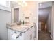 Bathroom featuring a granite countertop, a sink, and a mirror with three lights at 2319 D R Bryant Rd, Lakeland, FL 33810