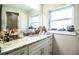 Bathroom featuring a sink, drawers, granite countertops, and a glass shower enclosure at 2319 D R Bryant Rd, Lakeland, FL 33810
