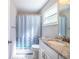 Bathroom featuring a shower curtain, toilet, and granite countertops at 2319 D R Bryant Rd, Lakeland, FL 33810