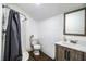Cozy bathroom featuring walk-in shower, vanity, and toilet, ideal for a small space at 2319 D R Bryant Rd, Lakeland, FL 33810