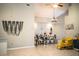 Bright dining area with a modern chandelier and large decorative wall art at 2319 D R Bryant Rd, Lakeland, FL 33810