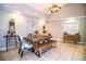 Spacious dining room showcasing a wooden table, bench seating, and tasteful decor at 2319 D R Bryant Rd, Lakeland, FL 33810