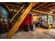 Open garage space with exposed wood framework and a car, useful for storage and projects at 2319 D R Bryant Rd, Lakeland, FL 33810