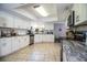 Updated kitchen features white cabinetry, stainless steel appliances, and tile flooring at 2319 D R Bryant Rd, Lakeland, FL 33810