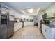 Bright kitchen showcases white cabinets, stainless steel appliances, and tile floors at 2319 D R Bryant Rd, Lakeland, FL 33810