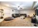 Spacious living room featuring a ceiling fan, carpeted floors, and plenty of natural light at 2319 D R Bryant Rd, Lakeland, FL 33810
