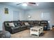 Cozy living room with a large leather sectional sofa and neutral decor at 2319 D R Bryant Rd, Lakeland, FL 33810