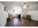 Sloped ceiling room with wood floors featuring kitchenette and bathroom in background at 2319 D R Bryant Rd, Lakeland, FL 33810