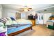 Spacious main bedroom featuring a ceiling fan, carpet floors, and ample closet space at 2319 D R Bryant Rd, Lakeland, FL 33810