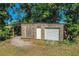 Outbuilding structure with one garage door and a storage area at 2319 D R Bryant Rd, Lakeland, FL 33810