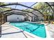 Screened-in pool featuring a spacious deck and outdoor living area at 2319 D R Bryant Rd, Lakeland, FL 33810