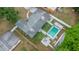 Aerial view of home with fenced pool and a well-manicured backyard at 2332 S Crystal Lake Dr, Lakeland, FL 33801