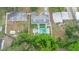 Discover the privacy of this property with its fenced backyard and inviting pool, captured from above at 2332 S Crystal Lake Dr, Lakeland, FL 33801