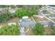 Overhead view reveals a fenced backyard with a sparkling pool and the home's well-maintained exterior at 2332 S Crystal Lake Dr, Lakeland, FL 33801