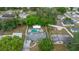 Aerial view showcases a private pool and backyard of this single-Gathering home at 2332 S Crystal Lake Dr, Lakeland, FL 33801