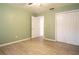 Bedroom with wood-look tile flooring and ample closet space at 2332 S Crystal Lake Dr, Lakeland, FL 33801