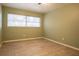 Bright bedroom featuring wood-look tile flooring and a window at 2332 S Crystal Lake Dr, Lakeland, FL 33801