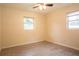 Bright bedroom featuring wood-look tile flooring and two windows at 2332 S Crystal Lake Dr, Lakeland, FL 33801