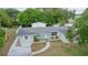 Inviting exterior featuring a well-manicured lawn, a charming walkway, and a welcoming front entrance at 2332 S Crystal Lake Dr, Lakeland, FL 33801