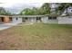 Inviting single-story home featuring a well-manicured lawn and a welcoming front entrance at 2332 S Crystal Lake Dr, Lakeland, FL 33801