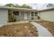 Charming single-story home with a quaint front entrance and manicured landscaping at 2332 S Crystal Lake Dr, Lakeland, FL 33801
